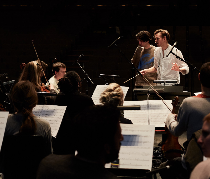 Robert Ames conducting string players